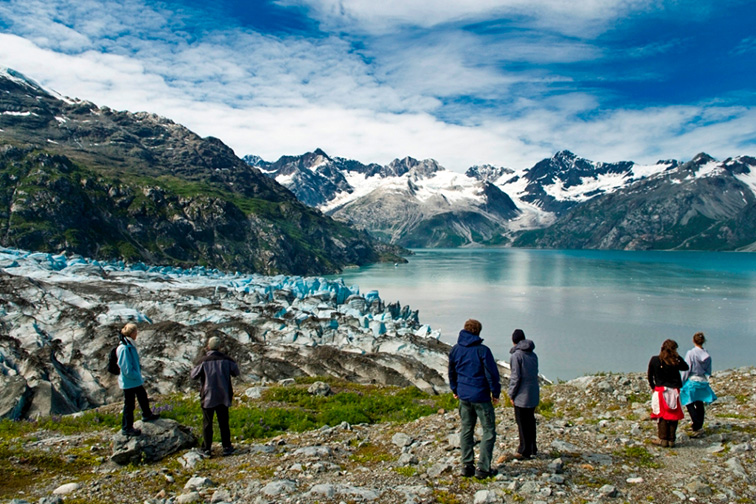 Visitors enjoying a glacier Glacier Bay National Park; Courtesy NPS