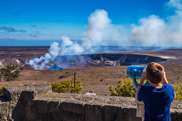 Young visitor checks out lava lake Hawaii Volcanoes National Park; Courtesy NPS