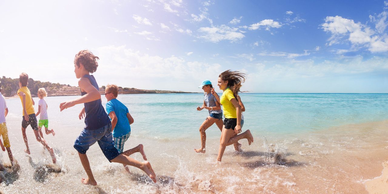 Teens and Tweens Running on Beach; Courtesy of Sergey Novikov/Shutterstock.com